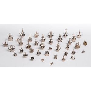 A collection of 38 small silver saint coronitas, Spanish and…