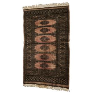 A small faded Bokhara style rug, 129 x 78 cm