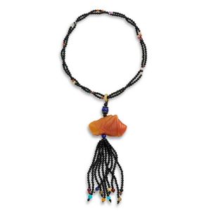 A Chiense red agate carved cricket formed pendant, 3.5 cm wide,