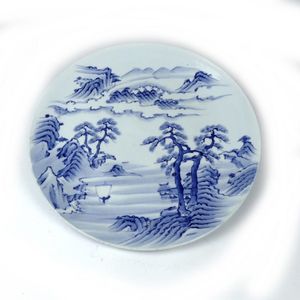 A large Japanese blue and white Arita porcelain charger, of…