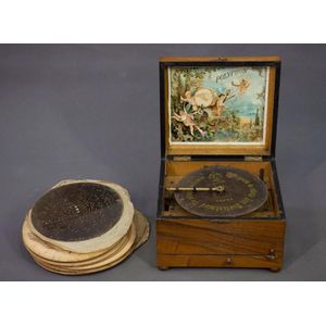 Swiss Polyphon. Small oak cased movement with two teeth missing…