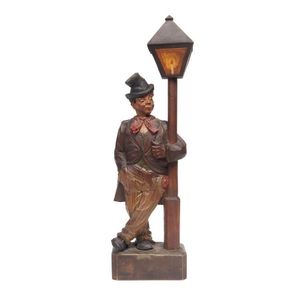 Automaton 'Whistling Man', carved and painted timber with clock…