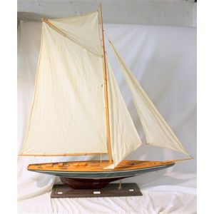 A superb mounted fully rigged scale model of a racing yacht.…