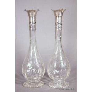 A pair of silver mounted small glass decanters, 1902 Birmingham,…