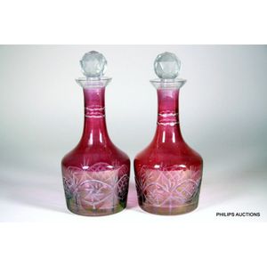 A pair of antique cranberry flash glass decanters, 19th century,…