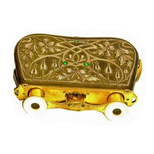 A pair of French silver decorated opera glasses, the leather…