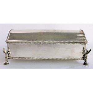 A silver plated inkwell, raised on putti feet, marked Sheffield.…
