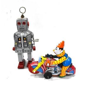 Two vintage mechanical tin toys, including a robot & a clown on…