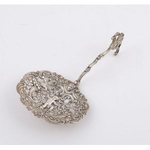 A pierced silver serving spoon with pseudo Hanau marks, 19th…