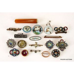 Eighteen mostly antique brooches including gold, silver,…