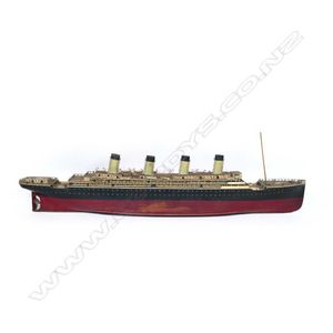 A scratch-built model of a four-funnel ocean liner probably the…