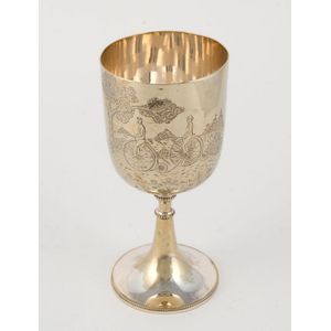 An antique English silver plated goblet engraved with penny…