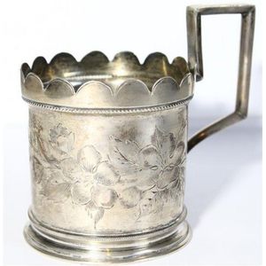 A Russian silver tea glass holder & a niello spoon, St…