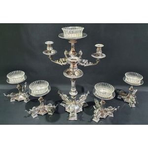 A silver plated centrepiece, three light, with scrolling ram's…