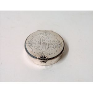 A mid-20th century ecclesiastical silver pyx box, the hinged…