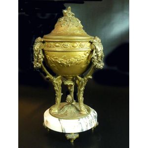 A French bronze patinated lidded urn upon a marble base. Height…