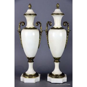 A pair of neoclassical bronze mounted marble urns, late 19th…