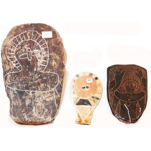 Two carved & painted Wandjina on stone. Artists unknown…