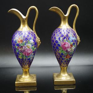 Good antique pair porcelian gilded ewers each with hand painted…