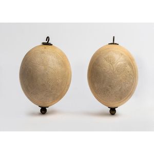 A pair of silver plate mounted, etched ostrich eggs, each…
