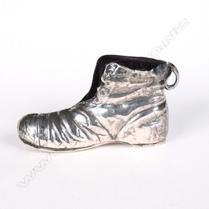 An uncommon Edwardian silver boot pin cushion, modelled with…