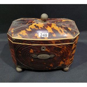 A William IV tortoiseshell tea caddy, sarcophagus shaped,…