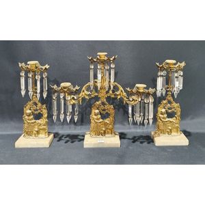 An early 19th century French three piece girandole garnitures,…