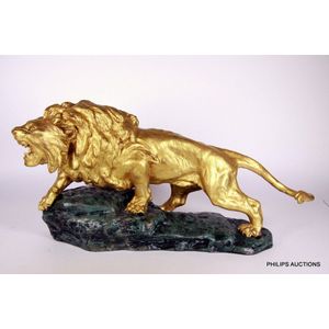 A spelter lion by Thomas Francois Cartier (1879-1943), a…