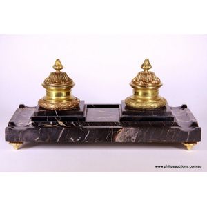 A fine Empire style ormolu and Portoro marble desk set, 19th…