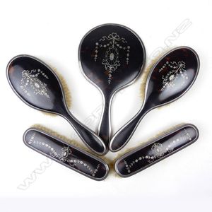 A silver and tortoiseshell pique work dressing table set,…