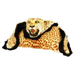 A leopard skin rug, full taxidermy mounted head with glass eyes…