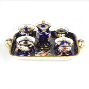 A 19th century French porcelain desk set, the two handled base…