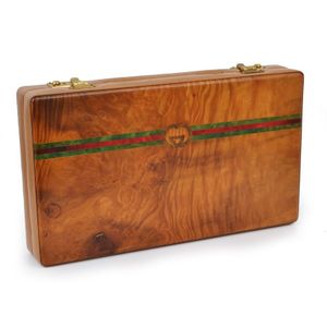 A backgammon set by Gucci, the walnut veneer case with taupe…