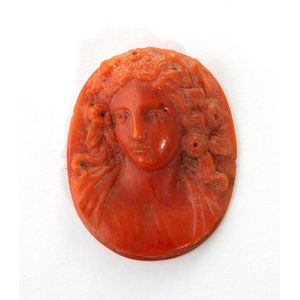 An antique carved red coral cameo, featuring a portrait, size…