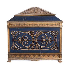 A very decorative gilt and blue painted triangular form…