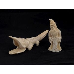 Jasper Rasmussen two carved whales teeth in the form of a…