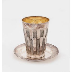 An Israeli sterling silver Kiddush cup and dish, with silver…