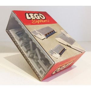 A grey Lego Fiat 1800 and a Lego System 521 set with grey…