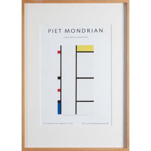 A framed poster print of the Piet Mondrain Cenntennial…