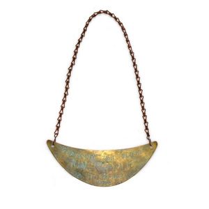 Aboriginal breastplate. Brass, crescent form. Stamped: 'Tobacco,…