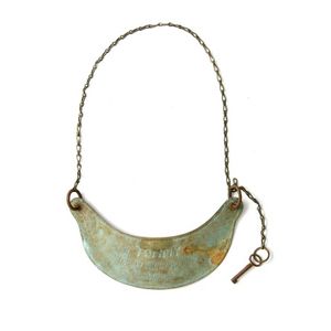 Aboriginal breastplate. Crescent form brass, chased & punched,…