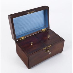 An antique tea caddy, mahogany and brass bun feet and…