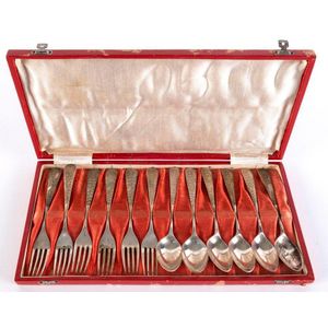 A set of silver teaspoons and cocktail forks in original box;…