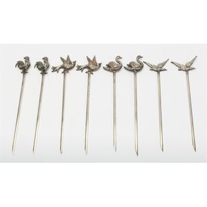 A set of eight silver-plated bird form cocktail skewers, French…