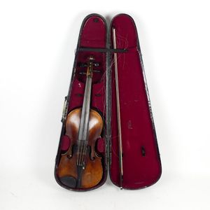 An antique violin and bow, indistinctly labelled 'Charlotte…