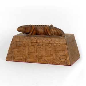 A wood carved trinket box, pyramid form with flat top, a lizard…