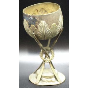 Vintage silver plate rowing trophy cup held up by oars and…