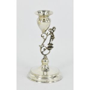 A sterling silver single candlestick, figural stem. Height 13…