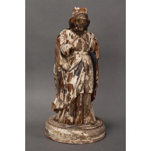 19th century carved religious figure, depicted standing wearing…