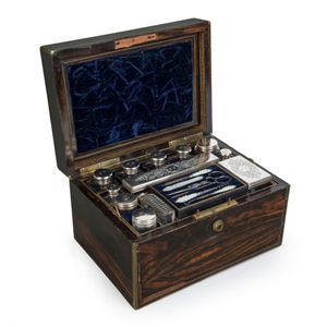 An antique English coromandel travel box fitted with silver…